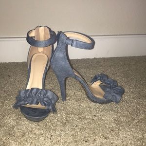 Heeled light blue sandals.